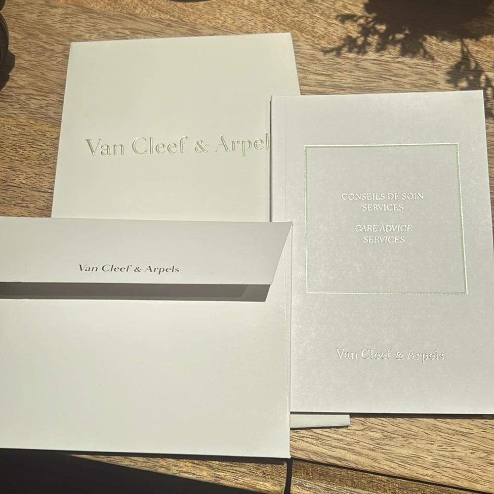 Van Cleef & Arpels bag, card and care advice booklet